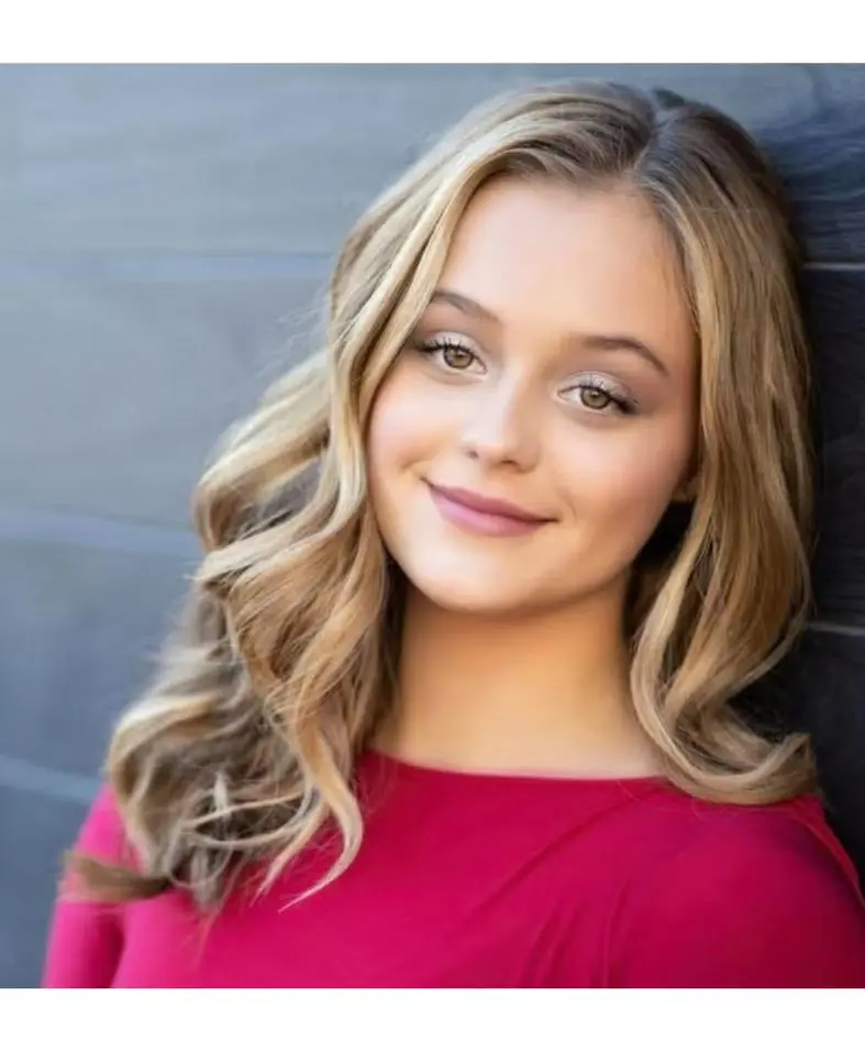 Smiling young woman with wavy hair