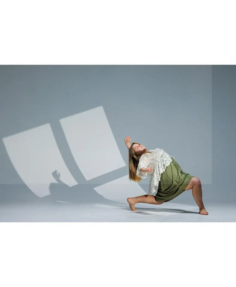 Woman performing contemporary dance in studio