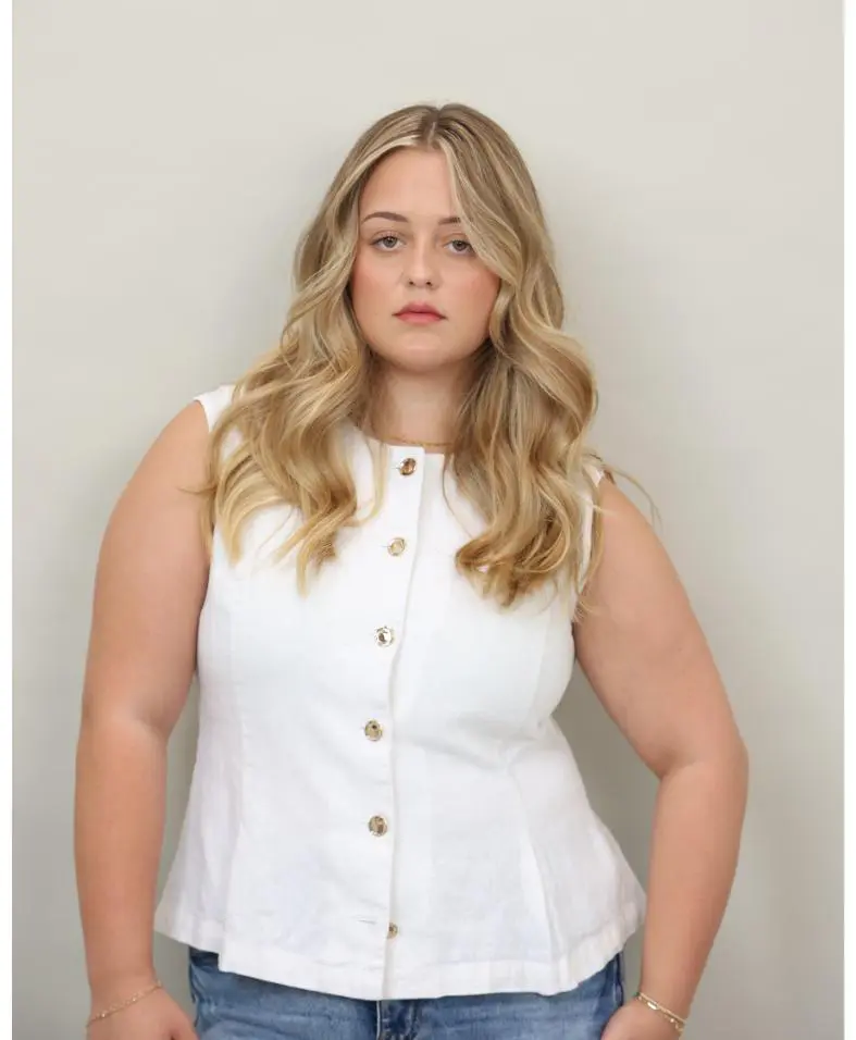 Blonde woman in white sleeveless top